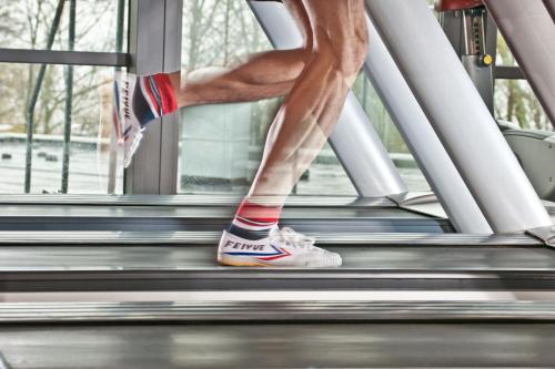 a close up of a person running on a treadmill at Dorint An der Kongresshalle Augsburg in Augsburg