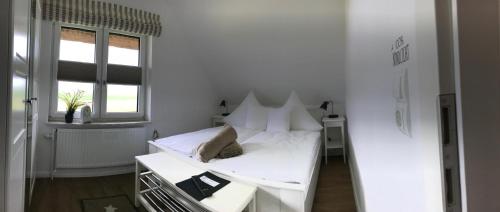 Katil atau katil-katil dalam bilik di Appartements unter Reet