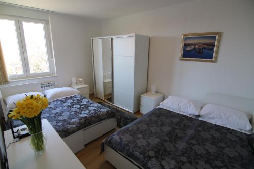 A bed or beds in a room at Volcano Rijeka