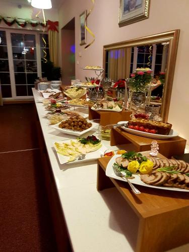 a buffet line with many different plates of food at Eva in Mrągowo