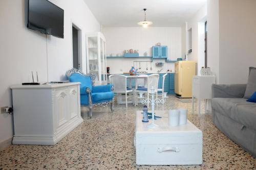 a living room with a couch and a table at Cefalù Caldura house in Cefalù