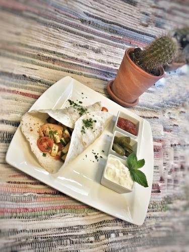 a white plate with some food on a table at Gasthaus Stefaner in Feistritz im Rosental