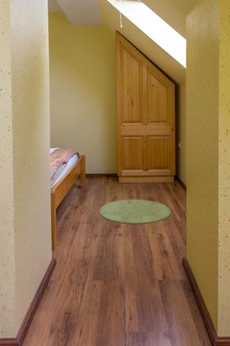 an empty room with a door and a rug at Turistična Kmetija Toman in Gornji Grad