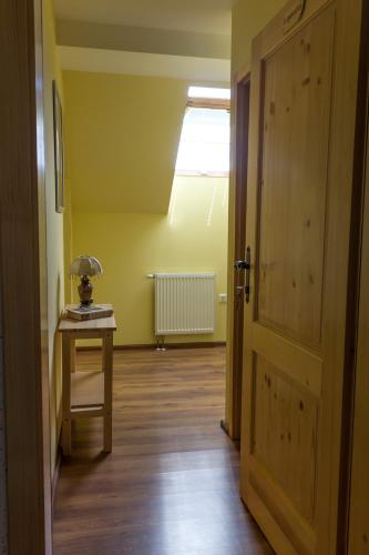 an empty room with a table and a window at Turistična Kmetija Toman in Gornji Grad