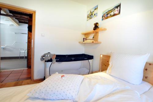 a bedroom with a bed and a mirror at Schmiedhof in Seefeld in Tirol