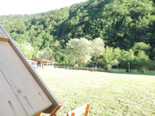 a view of a field with a mountain in the background at Camp Vrbas in Rekavice