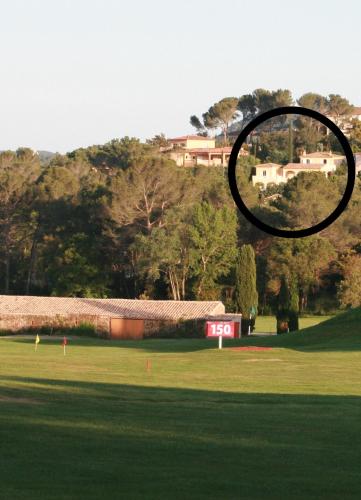 a view of a field with a house on a hill at Villa familiale avec vue imprenable in Saint-Raphaël