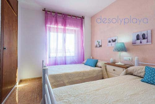 Кровать или кровати в номере desolyplaya Playamar I