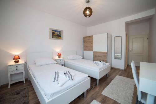 Ένα ή περισσότερα κρεβάτια σε δωμάτιο στο De Luxe Apartment Mediteran 2****