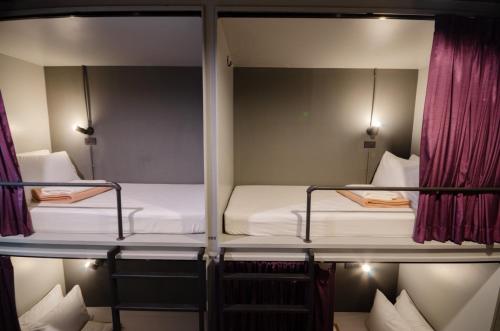 Postel nebo postele na pokoji v ubytování Tian Tian Hostel