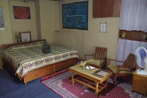 Postel nebo postele na pokoji v ubytování Orchard Huts