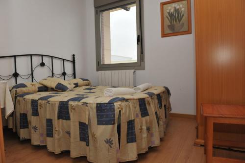 Postel nebo postele na pokoji v ubytování Apartamento Turístico La Casa del Gato