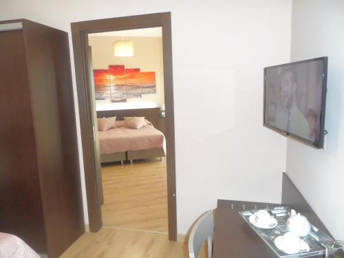 a room with a room with a bed and a mirror at BELLAVISTA B&b in Lamezia Terme