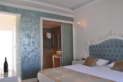 Cama o camas de una habitación en Olivias Group Hotel