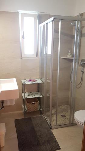a bathroom with a shower and a sink at Pension Lärchenhof in Naturno