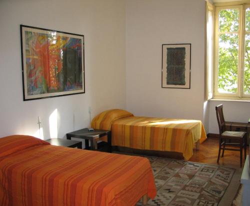 Ein Bett oder Betten in einem Zimmer der Unterkunft Al Porta Susa B&B