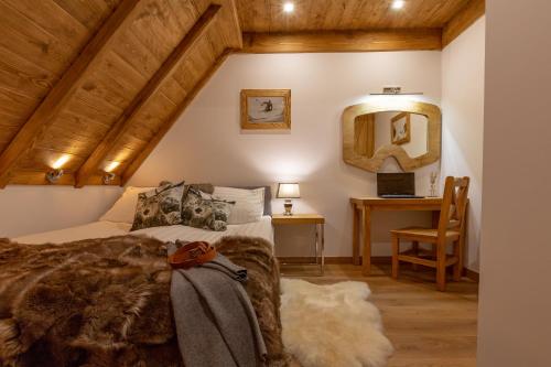 Postel nebo postele na pokoji v ubytování Nosalowski Wypas Jacuzzi & Sauna