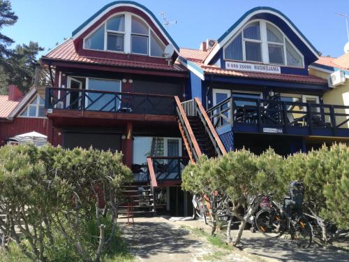 a house with bikes parked in front of it at Curonian Coast studio in Nida