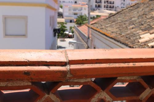a view of a building from a balcony at Casa Malpique in Albufeira