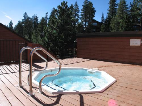 a hot tub sitting on top of a deck at Mammoth Village Properties by 101 Great Escapes in Mammoth Lakes