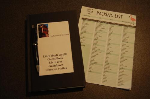 a book with a packing list and a menu at La Torretta in Beverino