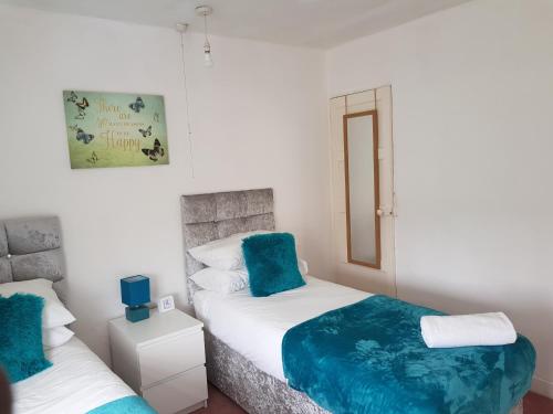 Ένα ή περισσότερα κρεβάτια σε δωμάτιο στο Vetrelax Basildon City Center Apartment