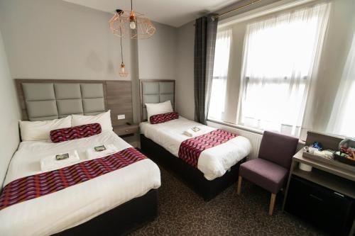 Postel nebo postele na pokoji v ubytování Euro Hotel