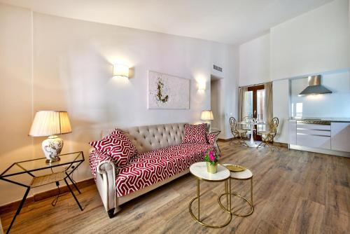 a living room with a couch and a table at Palma Old Town - Turismo de Interior in Palma de Mallorca