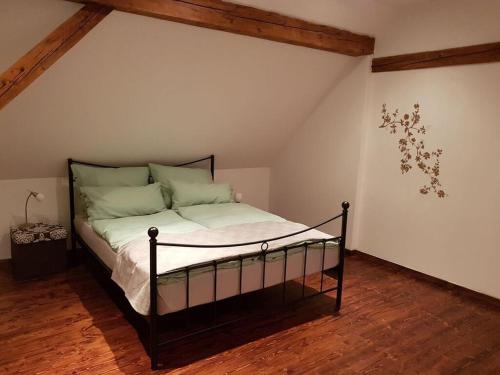 a bedroom with a bed in a attic at Klementina in Vrbovsko