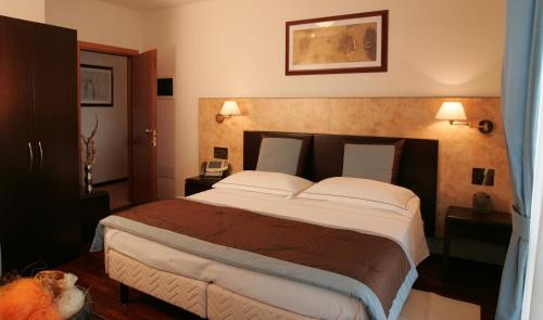 Cama o camas de una habitación en Residence Le Magnolie