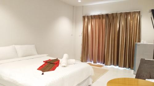 Кровать или кровати в номере Baan Kub Doi Mae Chaem