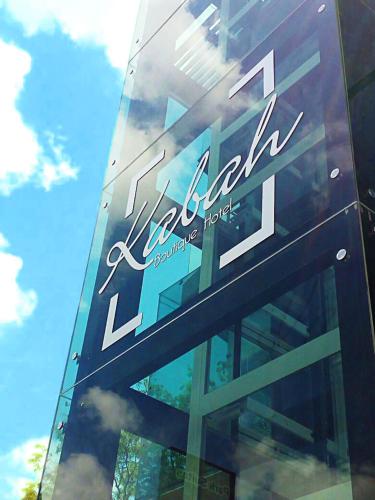 a building with a sign on the side of it at KABAH Cancun Hotel Boutique in Cancún