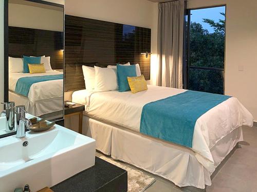 Cama o camas de una habitación en Kabah Boutique Hotel