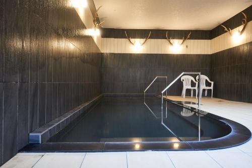 Bazén v ubytování Sounkyo Onsen Hotel Kumoi nebo v jeho okolí
