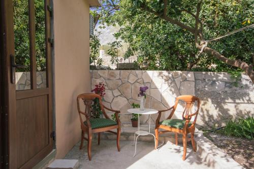 two chairs and a table on a patio at Studio Jeff 1 in Kotor