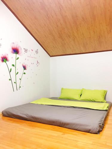 Una cama o camas en una habitación de Pensee Guesthouse