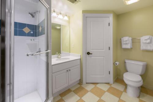 a bathroom with a shower and a toilet and a sink at Holiday Inn Club Vacations South Beach Resort in Myrtle Beach