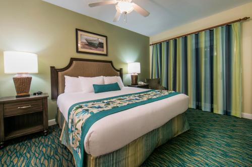a hotel room with a large bed and a window at Holiday Inn Club Vacations South Beach Resort in Myrtle Beach