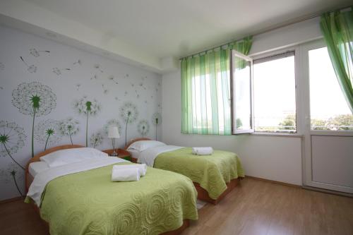Posteľ alebo postele v izbe v ubytovaní City Center Accommodation