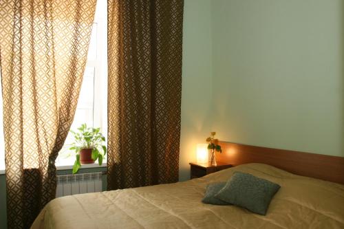 Postel nebo postele na pokoji v ubytování Nevsky 78 Apart-hotel