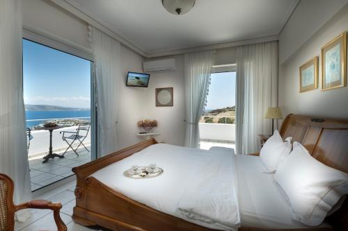 Postel nebo postele na pokoji v ubytování Sounio Villa