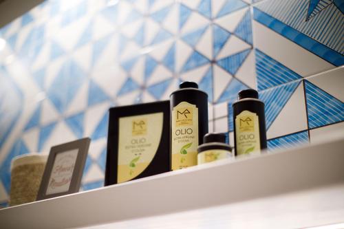 a shelf with four bottles of hair products on it at MelRose Sorrento in Sorrento