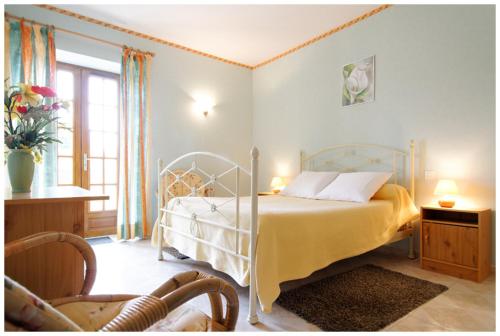 Katil atau katil-katil dalam bilik di La Ferme des Grisettes