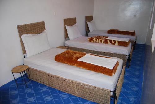 Кровать или кровати в номере Kasbah Ait Bouguemez