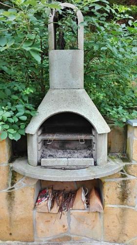 a stone oven sitting on top of a brick wall at hřensko 114 in Hřensko