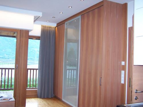 a glass door in a room with a balcony at St. Ulrichhof in Lana