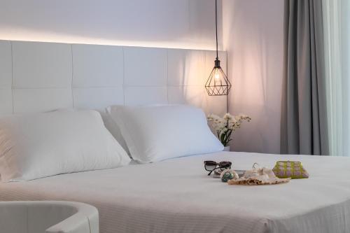 Postel nebo postele na pokoji v ubytování Hotel Elite