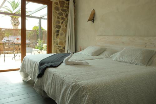 A bed or beds in a room at El Rancho