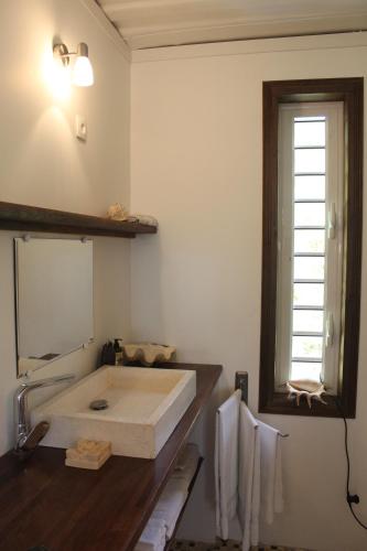 a bathroom with a sink and a mirror at carré coco in Sainte-Luce