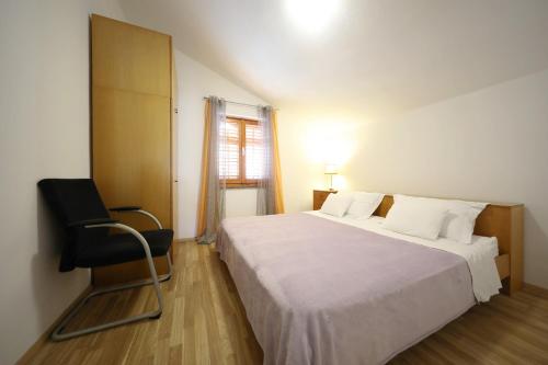 En eller flere senger på et rom på Apartment Mareta